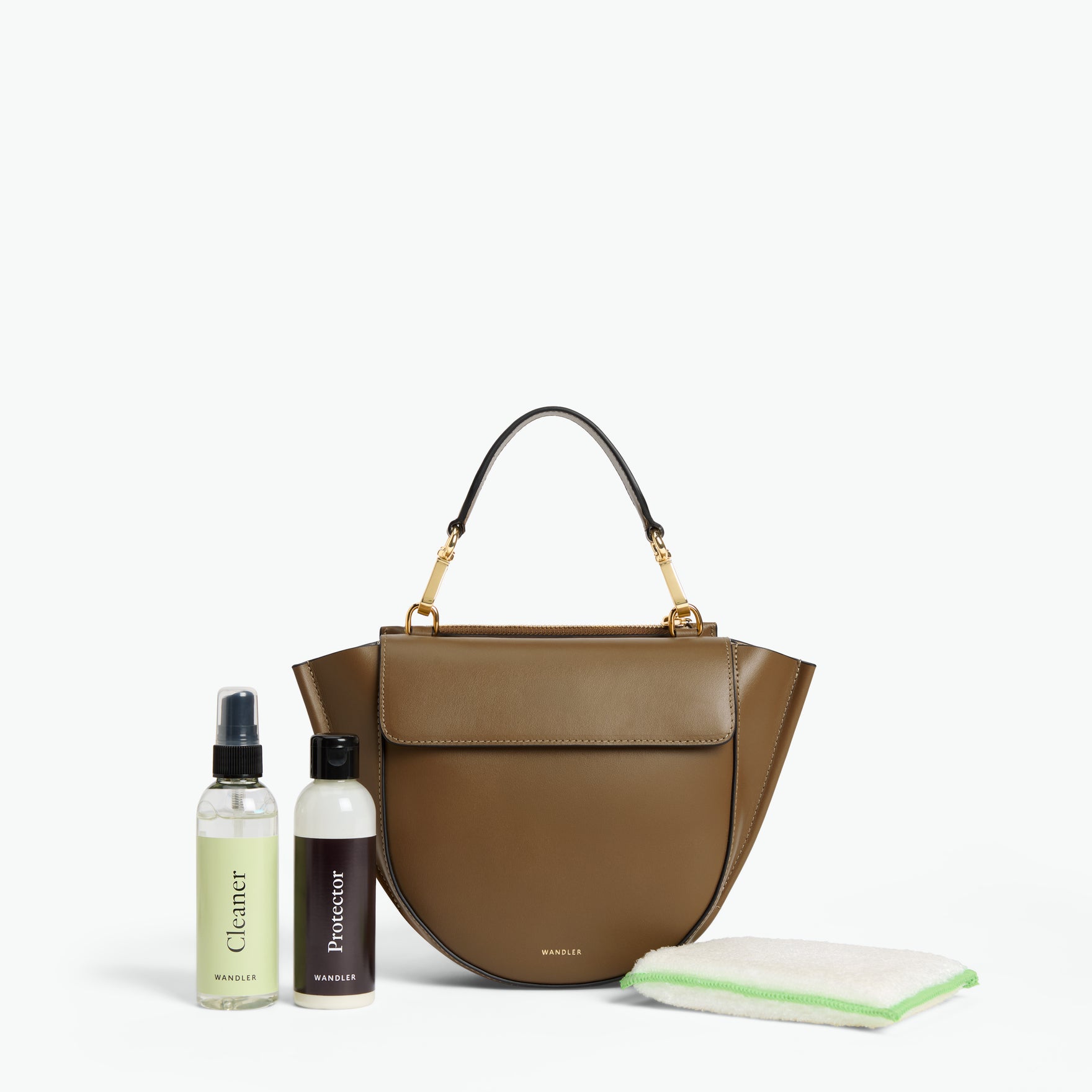 Wandler Smooth and Crust leather care-kit containing leather cleaner, protector and sponge, pictured alongside Wandler Hortensia Mini.
