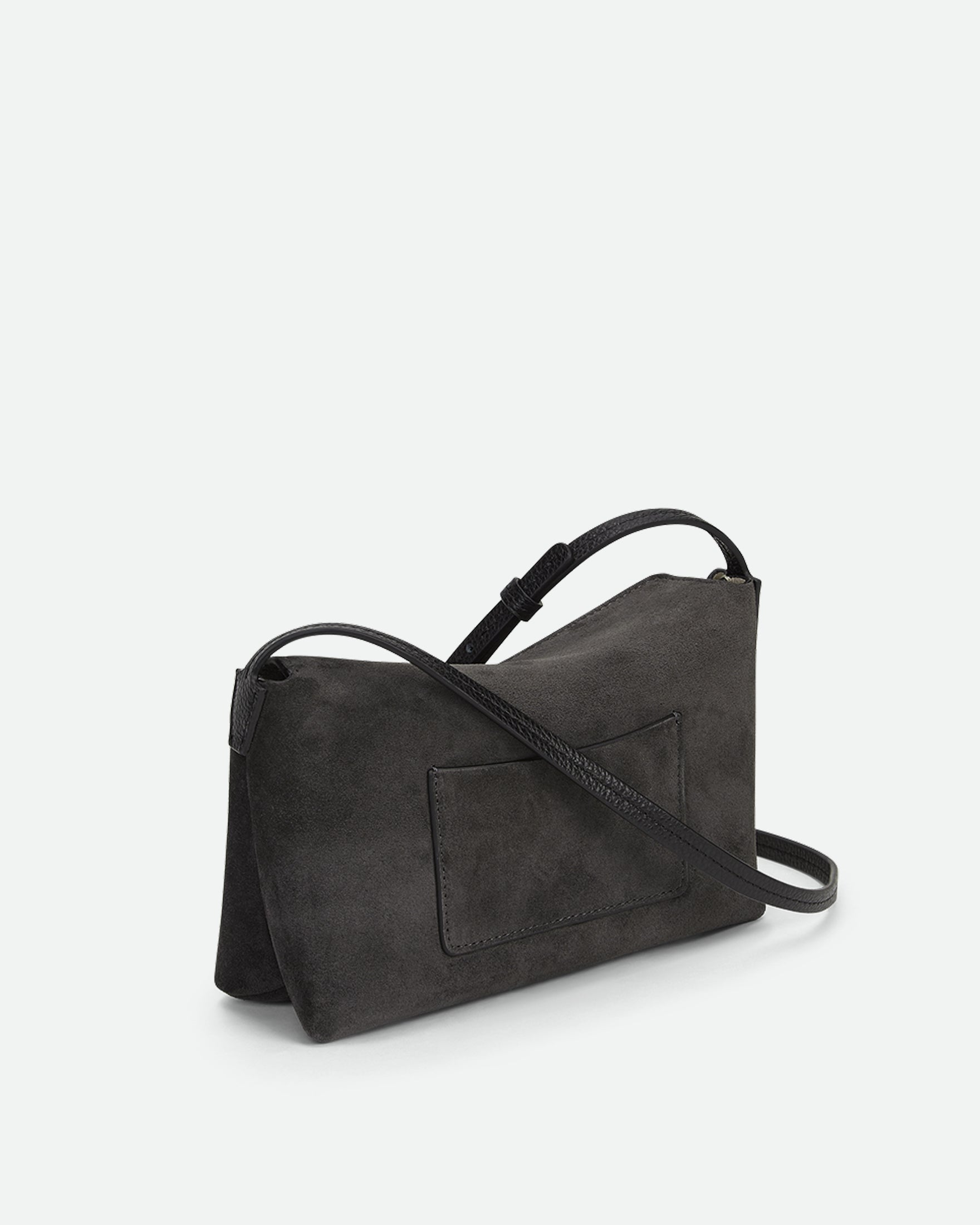 Wandler Penelope Slouch Mini in the color Space Suede, grey, made from Italian calf leather with golden hardware and slim adjustable strap, backside view. 