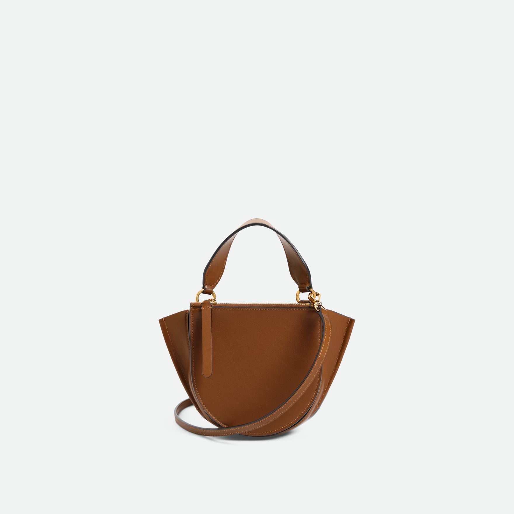 Wandler Hortensia Bag Piccola in the color Saddle, warm brown, Italian calf leather with golden hardware, rounded silhouette and top handle, backside view.