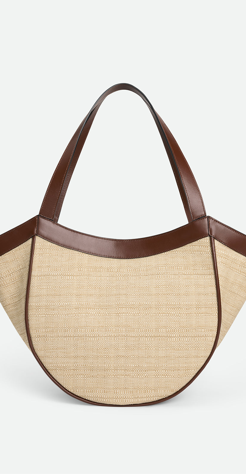 Wandler Hortensia Slouch Tote in color Beige Raffia made with raffia made from calf leather with golden hardware, backside view. 