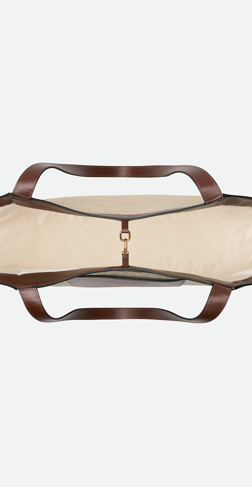 Wandler Hortensia Slouch Tote in color Beige Raffia made with raffia made from calf leather with golden hardware, from above showing the inside of the bag and the clasp closure.