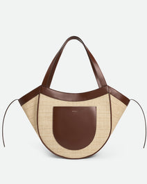 Wandler Hortensia Slouch Tote in color Beige Raffia made with raffia made from calf leather with golden hardware, front view.