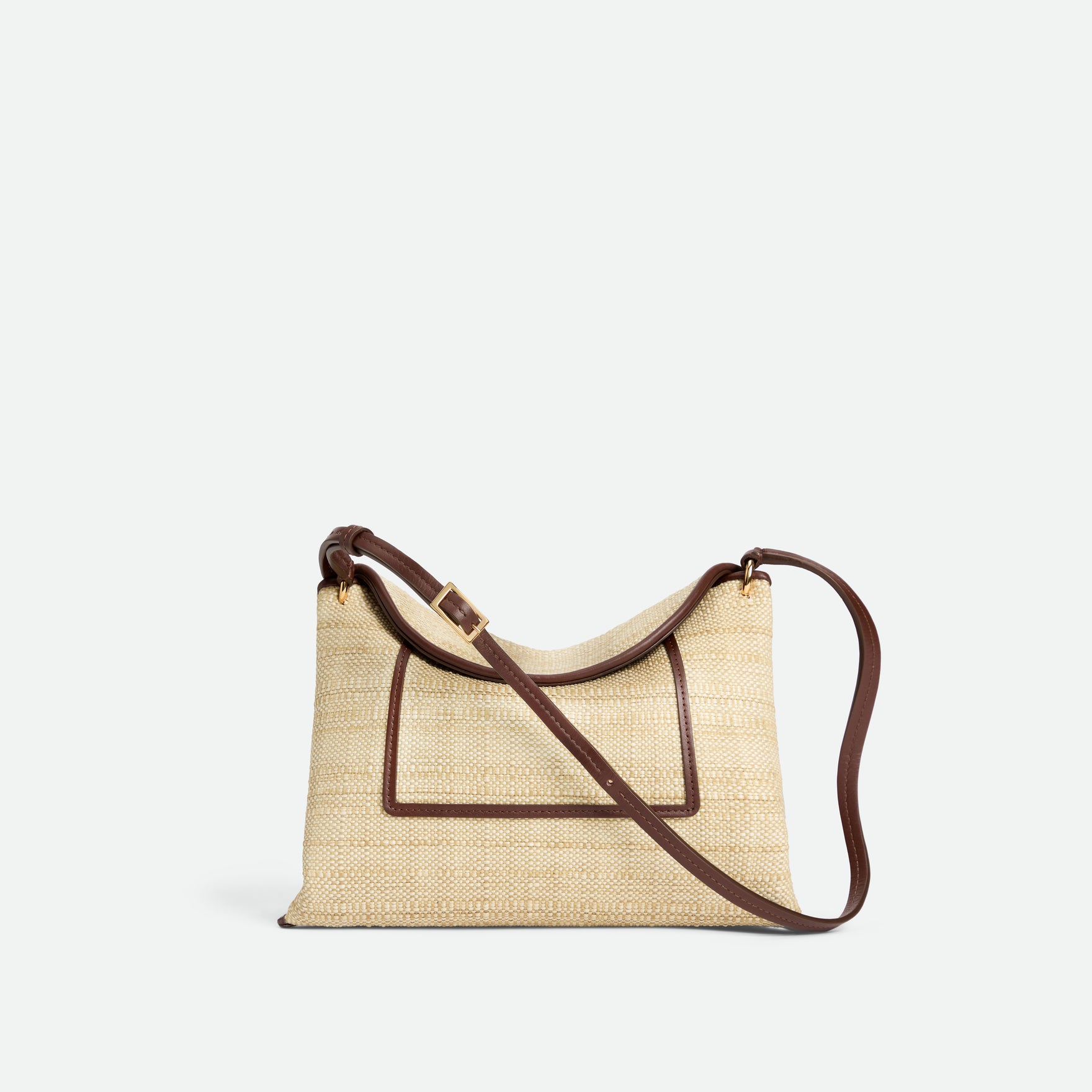 Wandler Penelope Slouch Bag in the color Beige Raffia, made from smooth calf leather with golden hardware and adjustable slim strap, front view