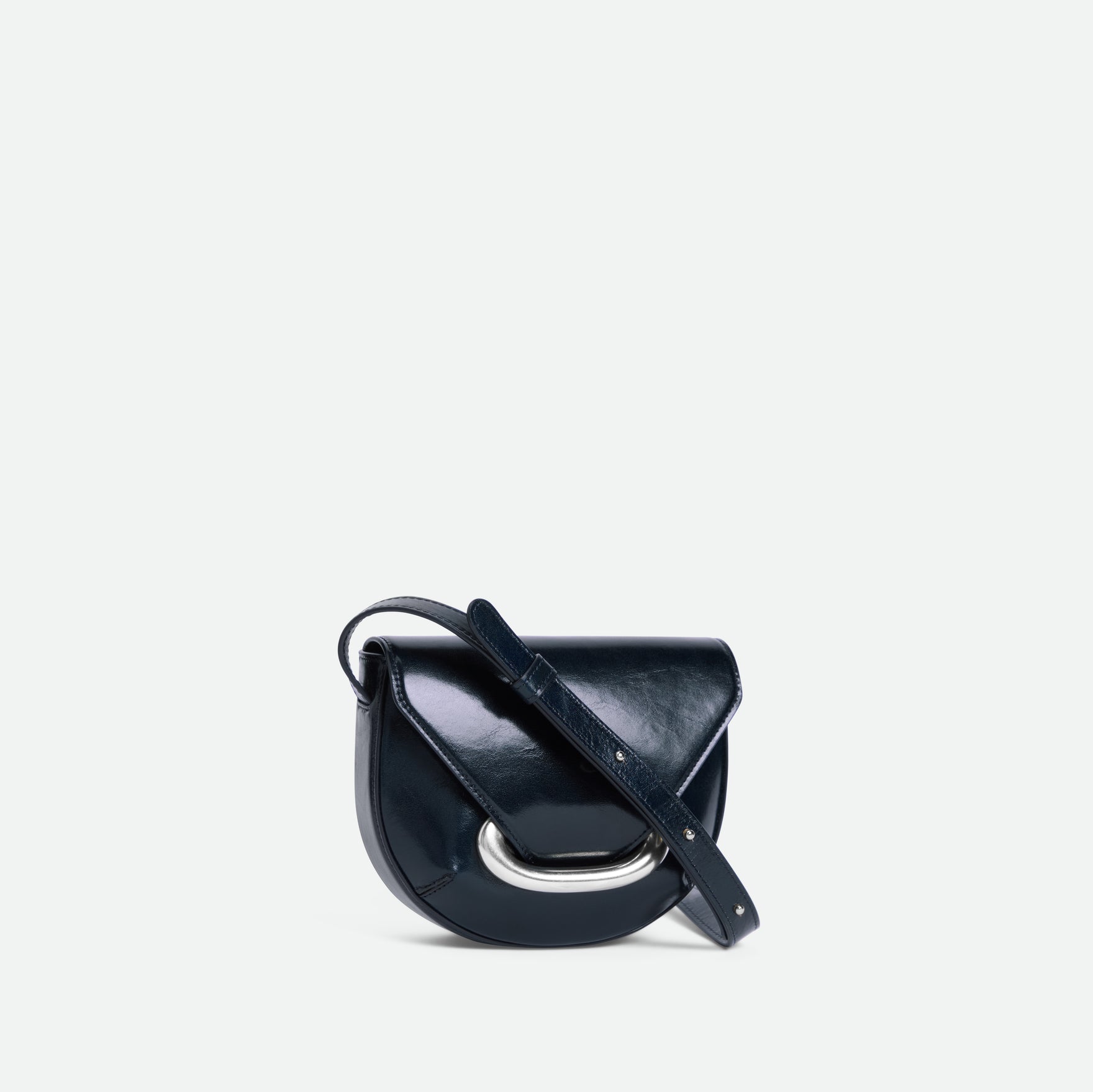Wandler Veneto Crossbody Small in Orion Glaze, deep dark blue, Italian calf leather with silver clasp hardware and structured silhouette, three quarters view. 