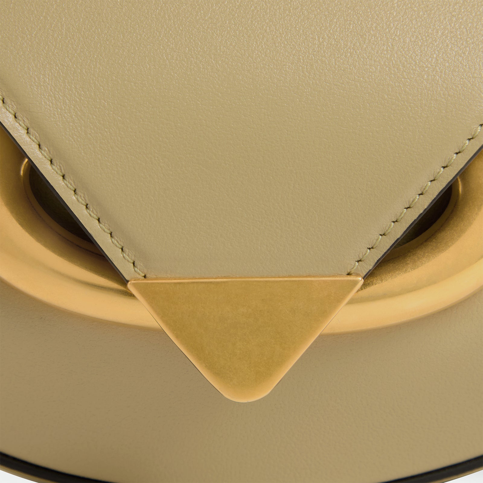 Wandler Veneto Crossbody Small in Peper, dark beige, made from Italian calf leather with golden clasp hardware and structured silhouette, close up detailing the leather and the clasp. 