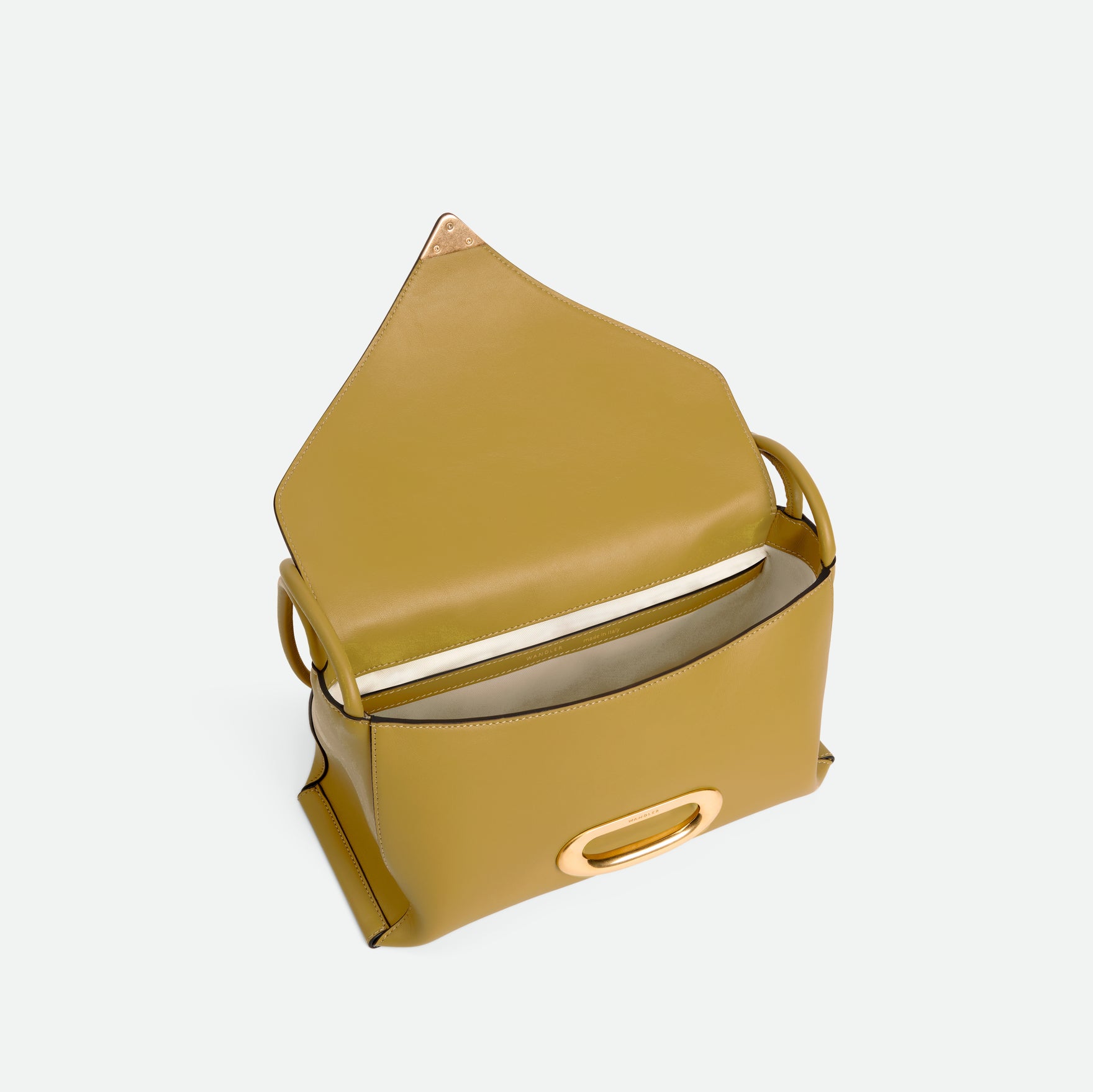 Wandler Veneto Shoulder Bag in the color Saffron, yellow, Italian calf leather with oversized golden clasp hardware and structured silhouette. The bag is pictured from the front with the flap open, giving a slight view of the inside of the bag.