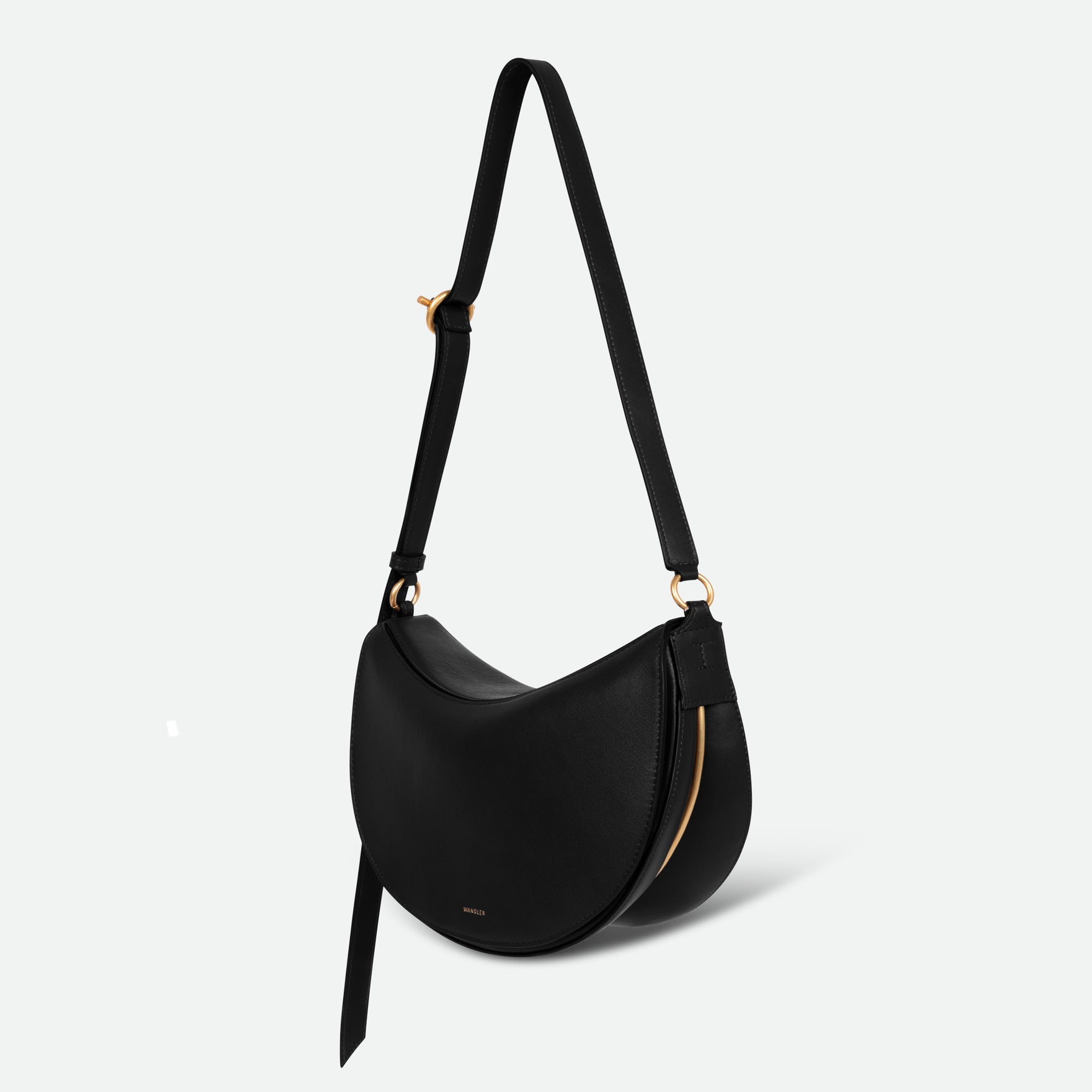 Wandler Kate Bag Big in the color Black, made from Italian calf leather with golden hardware and adjustable shoulder strap, backside view.