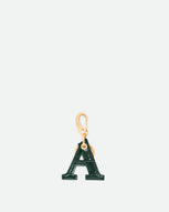 Wandler Bag Charm Letter in the color Olive Croco, green with crocodile print, Letter M, made from brass, lambskin leather with golden hardware, front view.