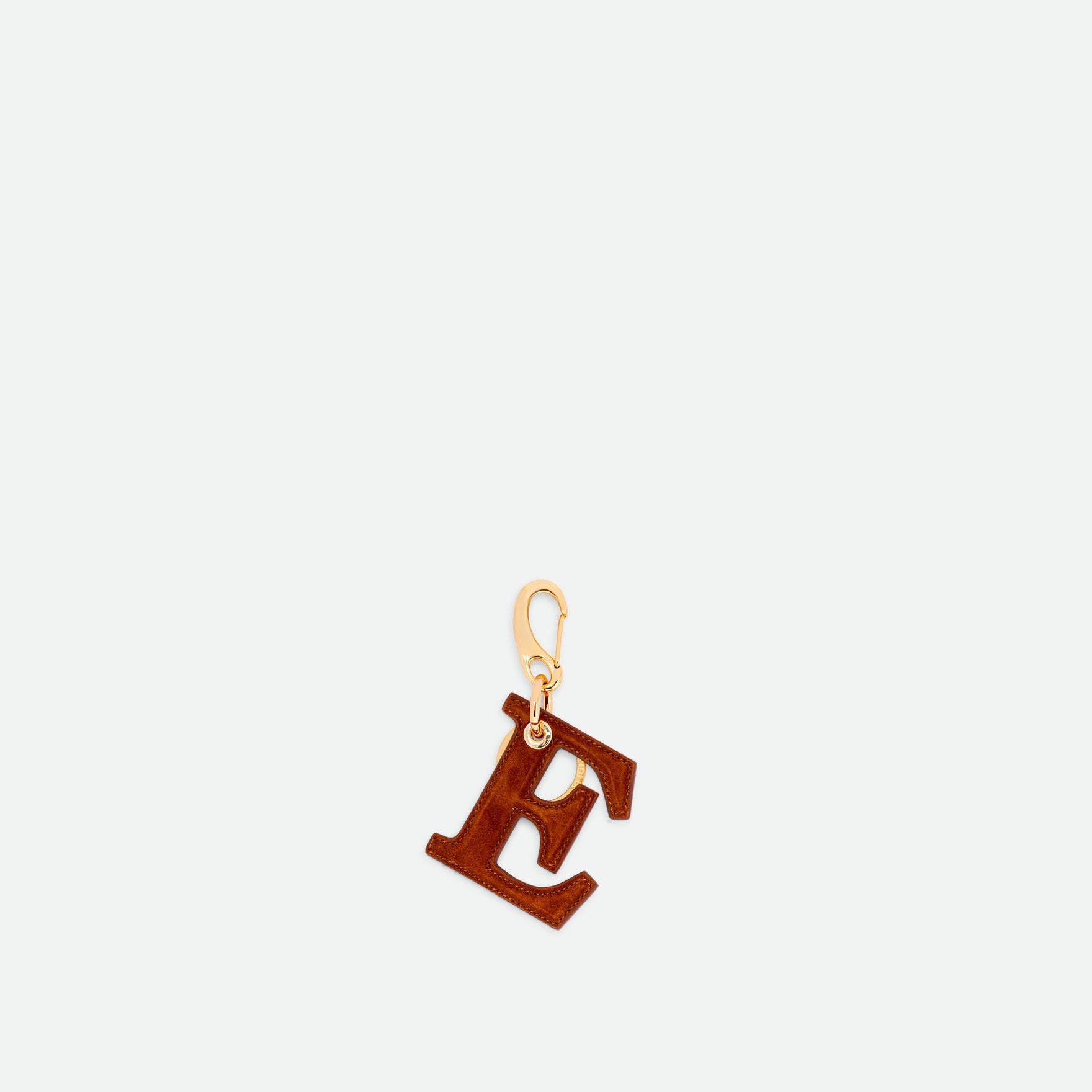 Wandler Bag Charm Letter in the color Tan Suede, caramel brown, letter E, made from brass, suede lambskin leather with golden hardware, front view.