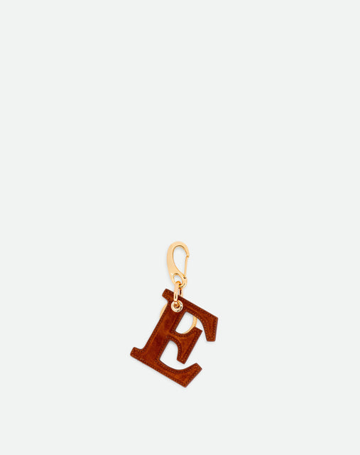 Wandler Bag Charm Letter in the color Tan Suede, caramel brown, letter E, made from brass, suede lambskin leather with golden hardware, front view.