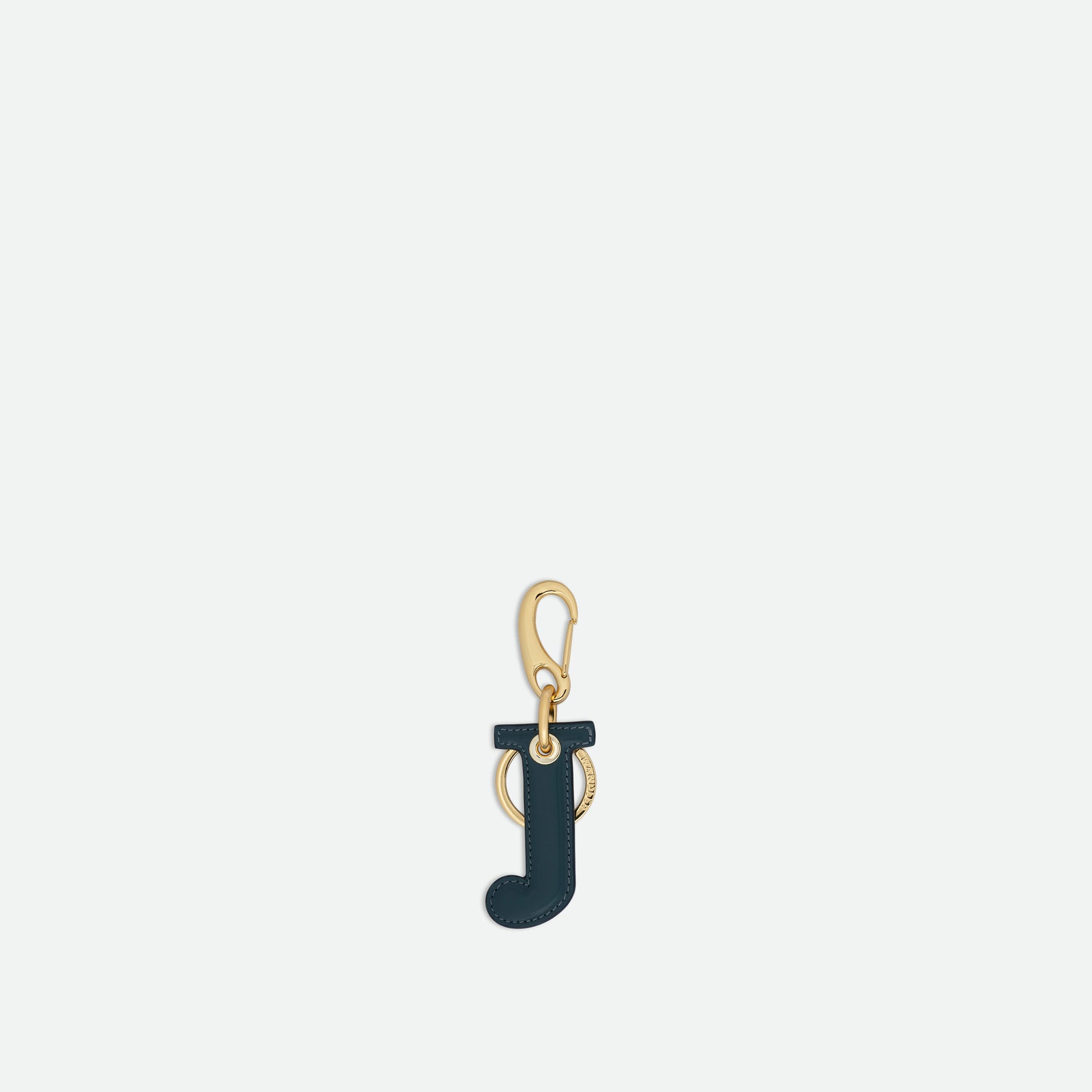 Wandler Bag Charm Letter in the color Teal, Letter J, made from brass, lambskin leather with golden hardware, front view.
