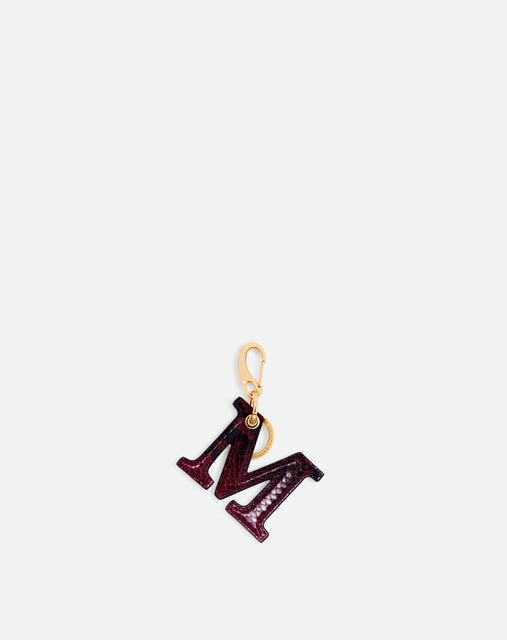 Wandler Bag Charm Letter in the color Bordeaux Python, bordeaux red with python motive, made from brass, lambskin leather with golden hardware, front view.
