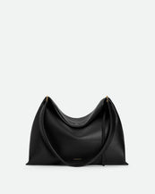 Wandler Penelope Tote Small in the color Black Crust made from calf leather with golden hardware and soft slouchy silhouette, front view.