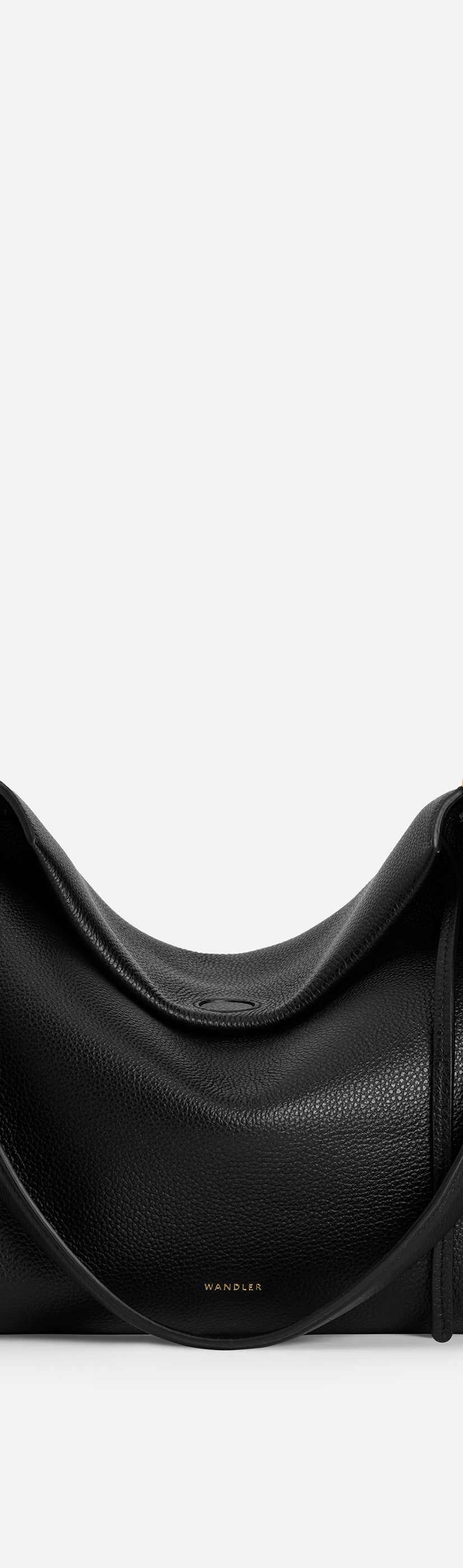 Wandler Penelope Tote Small in the color Black Crust made from calf leather with golden hardware and soft slouchy silhouette, front view.
