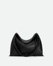 Wandler Penelope Tote Small in the color Black Crust made from calf leather with golden hardware and soft slouchy silhouette, front view.