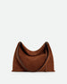 Wandler Penelope Tote Small in the color Saddle Suede calf leather with golden hardware and soft slouchy silhouette, front view.