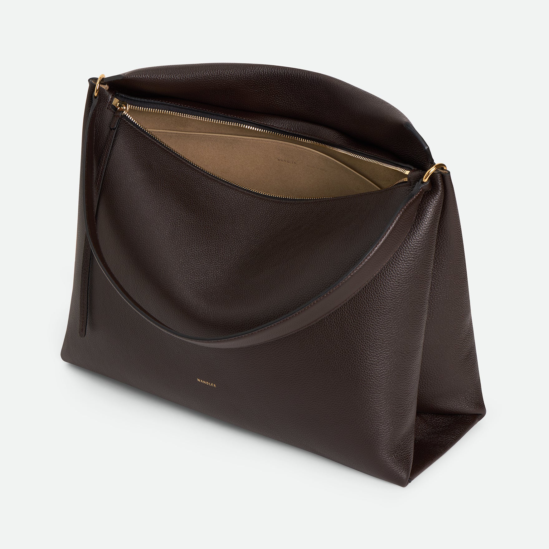 Wandler Penelope Tote in the color Soil Crust, made from Italian calf leather with golden hardware and soft structured silhouette, pictured from above with zipper open, giving a glimpse of the inside of the bag.