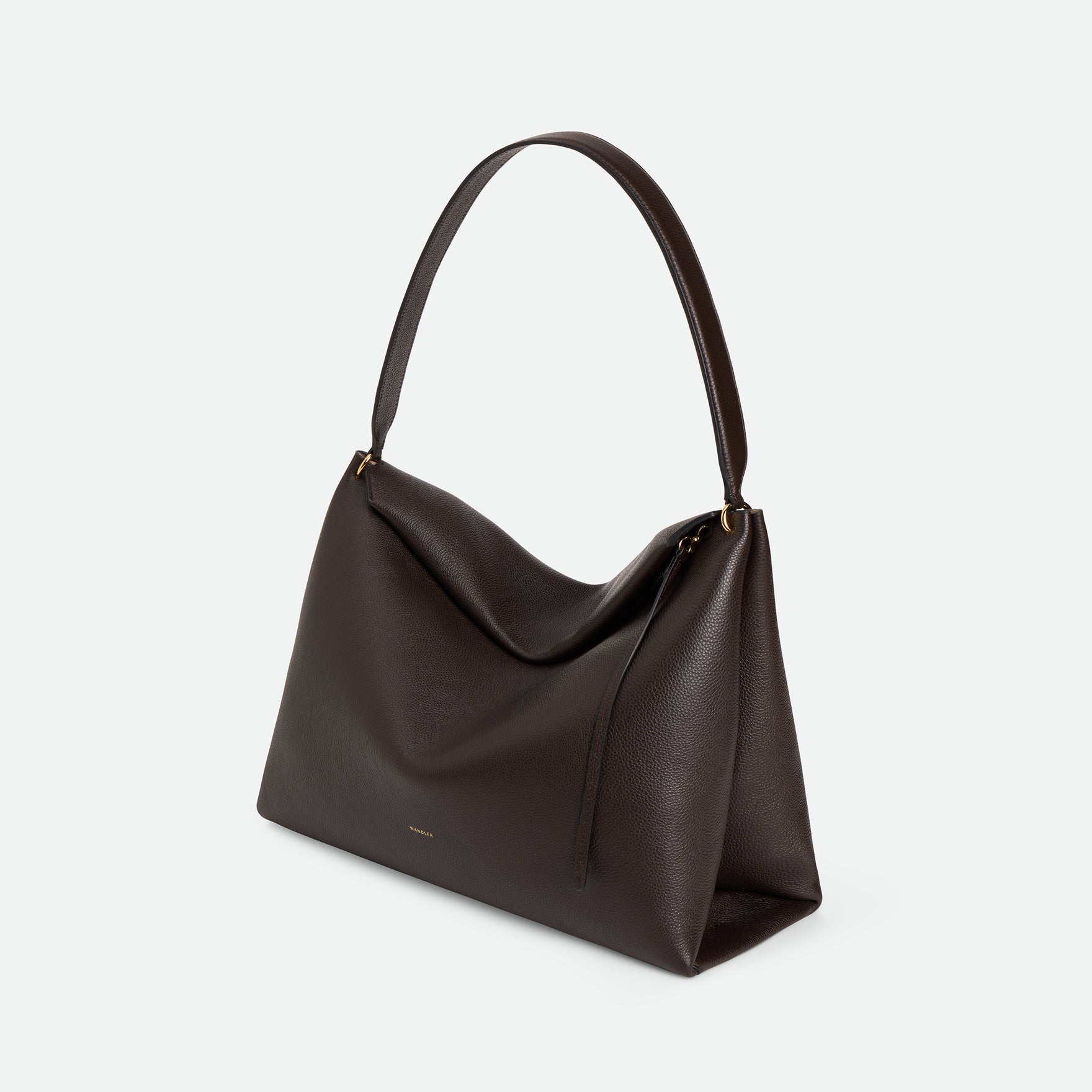 Wandler Penelope Tote in the color Soil Crust, made from Italian calf leather with golden hardware and soft structured silhouette, three quarters view.