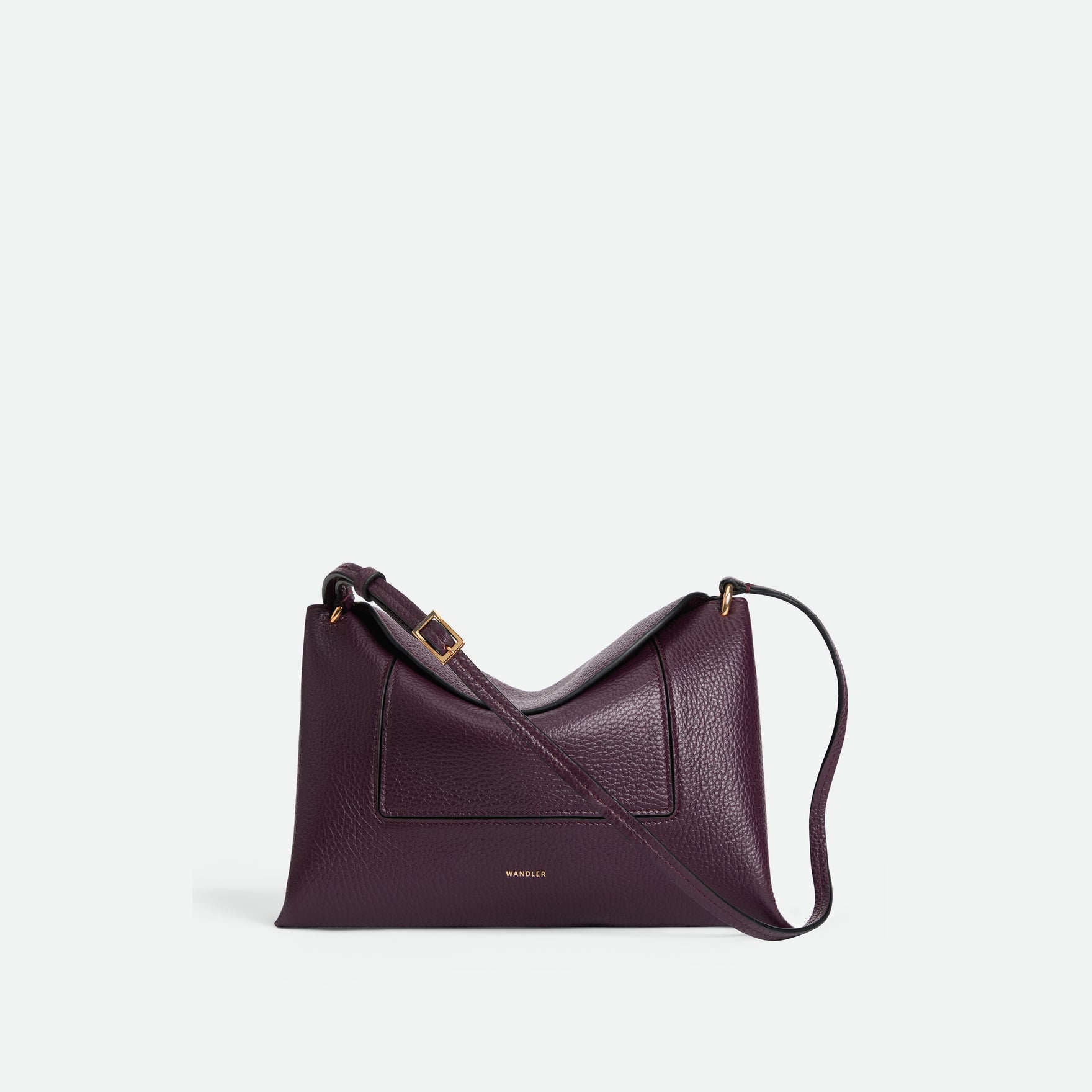 Wandler Penelope Slouch Bag in the color Aubergine Crust, made from calf leather with golden hardware and adjustable slim strap, front view.