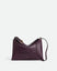 Wandler Penelope Slouch Bag in the color Aubergine Crust, made from calf leather with golden hardware and adjustable slim strap, front view.