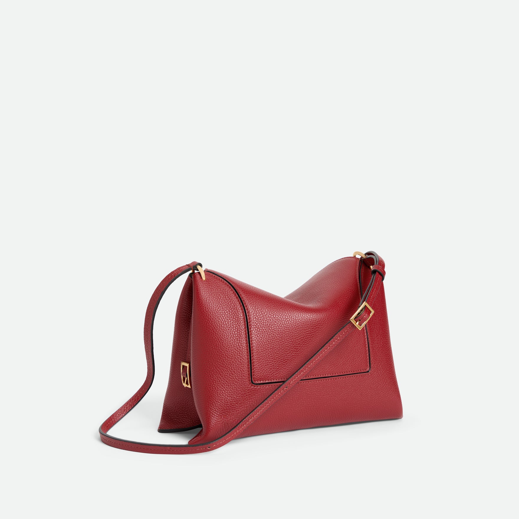 Wandler Penelope Slouch Bag in the color Scarlet Crust, made from calf leather with golden hardware and adjustable slim strap, backside view.