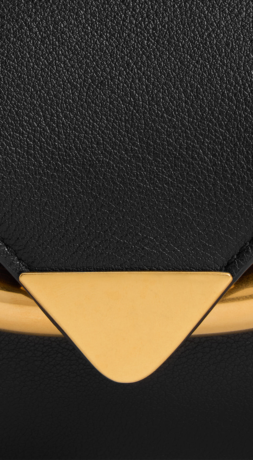 Wandler Veneto Shoulder Bag Small in the color Island, made from Italian calf leather with oversized golden clasp hardware, structured silhouette, close up detailing the clasp and leather.