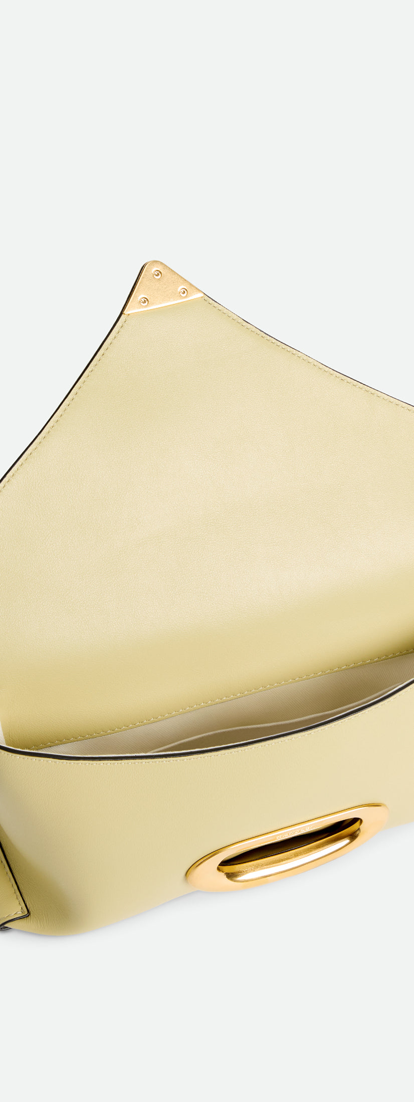 Wandler Veneto Shoulder Bag Small in the color Island, made from Italian calf leather with oversized golden clasp hardware, structured silhouette, pictured with flap open, giving a glimpse into the inside of the bag.