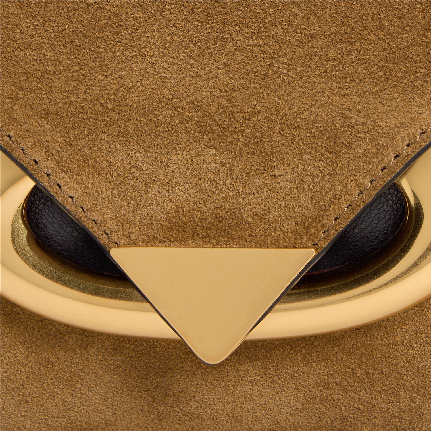Wandler Veneto Shoulder Bag Small in the color Tabacco Suede, made from Italian calf leather with oversized golden clasp hardware, structured silhouette, close up detailing the clasp and leather.