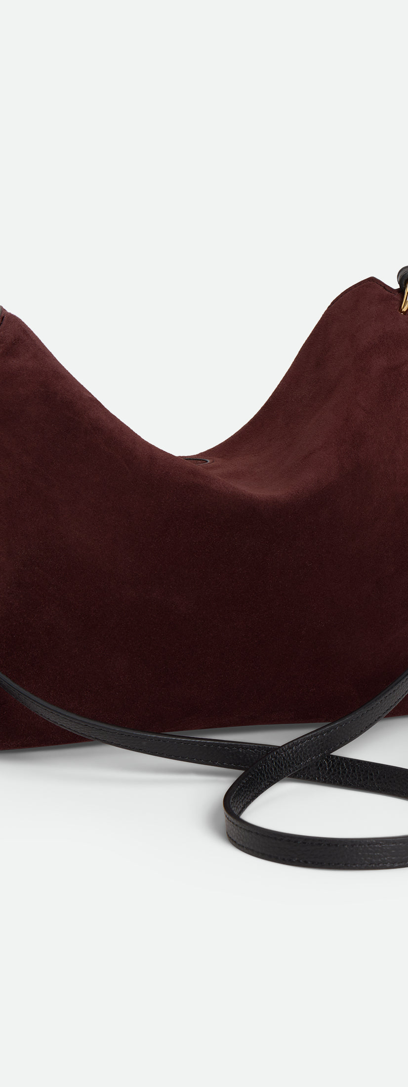 Wandler Penelope Tote Small in the color Acai Suede / Black made from calf leather with golden hardware and soft slouchy silhouette, backside view.