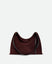 Wandler Penelope Tote Small in the color Acai Suede / Black made from calf leather with golden hardware and soft slouchy silhouette, front view.