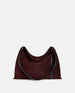 Wandler Penelope Tote Small in the color Acai Suede / Black made from calf leather with golden hardware and soft slouchy silhouette, front view.