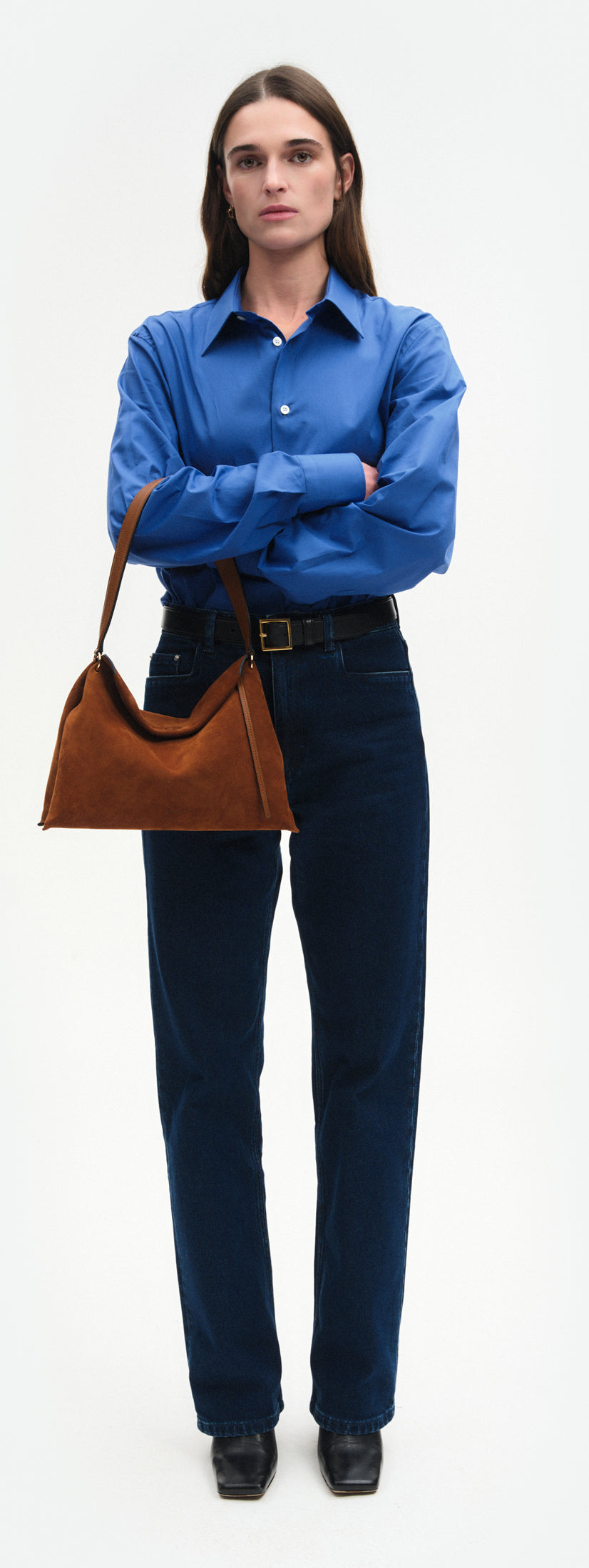 Wandler Penelope Tote Small in the color Saddle Suede calf leather with golden hardware and soft slouchy silhouette, worn on the forearm by model, full body picture.