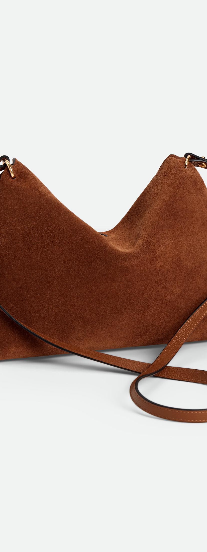 Wandler Penelope Tote Small in the color Saddle Suede calf leather with golden hardware and soft slouchy silhouette, backside view.
