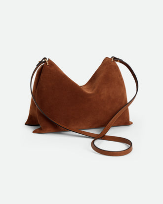 Wandler Penelope Tote Small in the color Saddle Suede calf leather with golden hardware and soft slouchy silhouette, backside view.