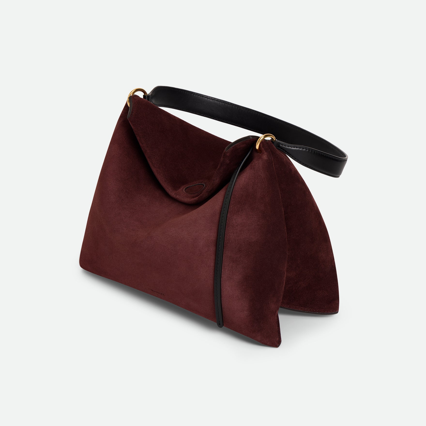 Wandler Penelope Tote Small in the color Acai Suede / Black made from calf leather with golden hardware and soft slouchy silhouette, three quarters view.