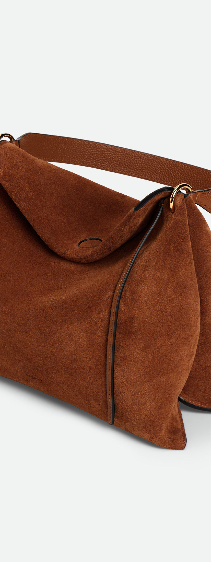 Wandler Penelope Tote Small in the color Saddle Suede calf leather with golden hardware and soft slouchy silhouette, threequarters view.