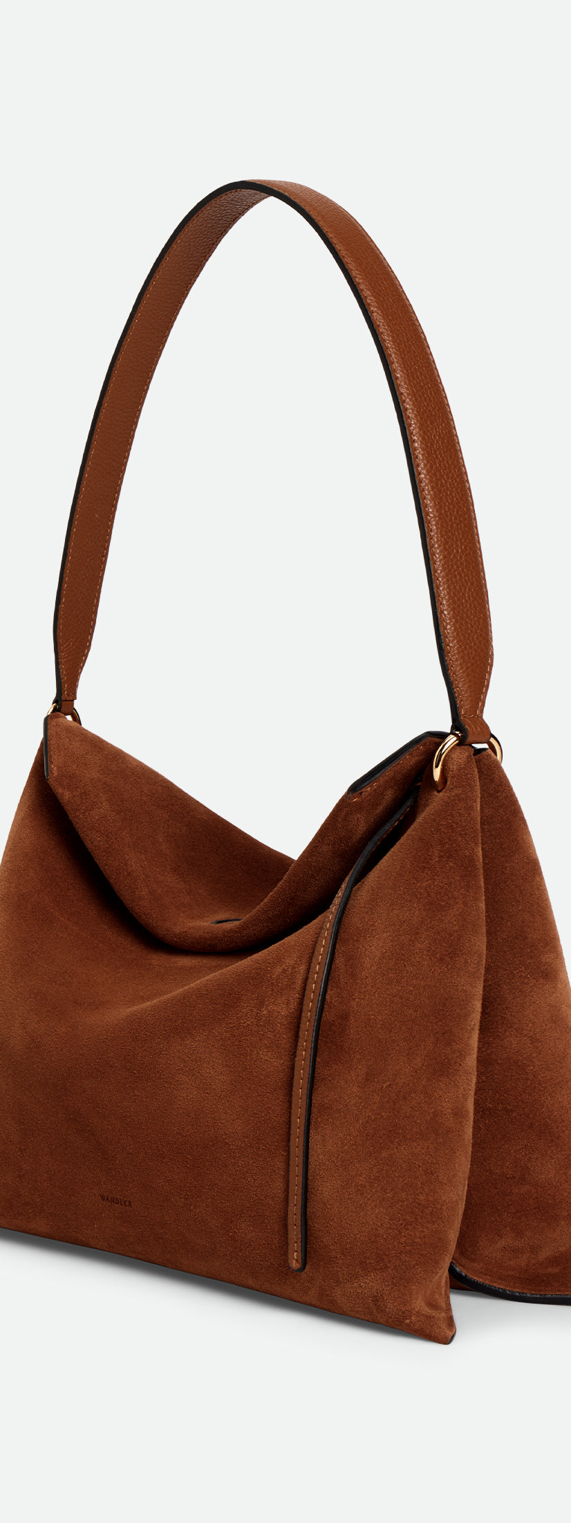 Wandler Penelope Tote Small in the color Saddle Suede calf leather with golden hardware and soft slouchy silhouette, three quarters view.