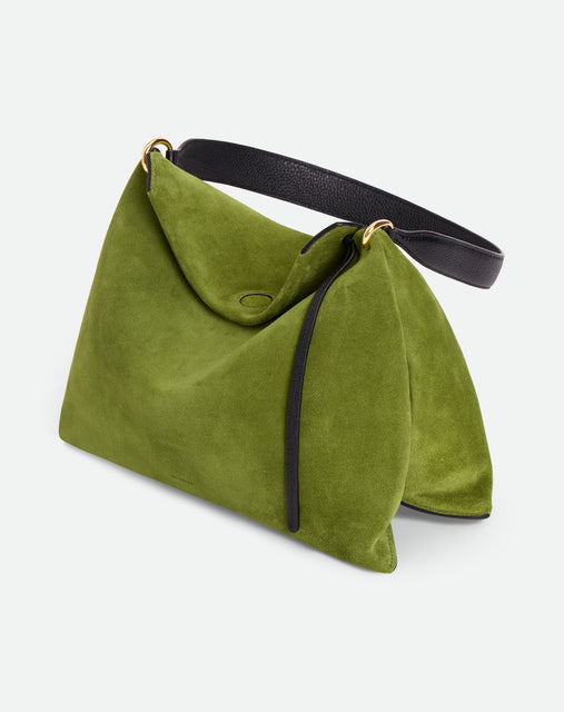 Wandler Penelope Tote Small in the color Verde Suede / Black made from calf leather with golden hardware and soft slouchy silhouette, pictured from above, three quarters view.