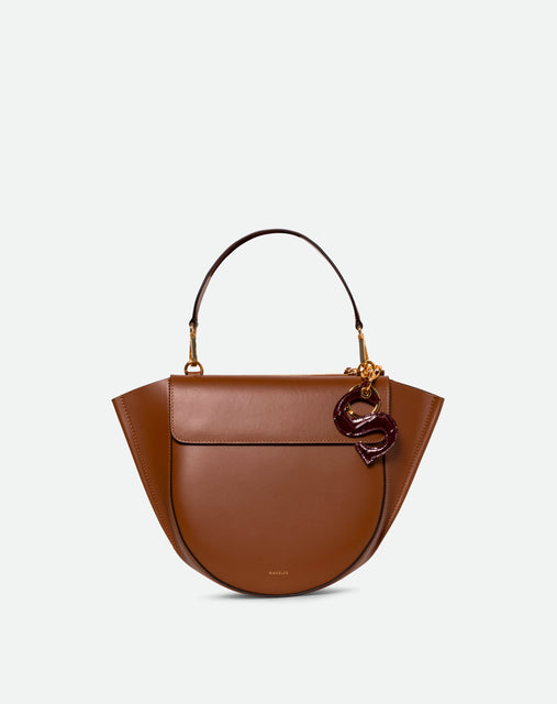 Wandler Bag Charm Letter in the color Bordeaux Croco, Letter S, made from brass, lambskin leather with golden hardware, pictured attached to bag as a bag charm.