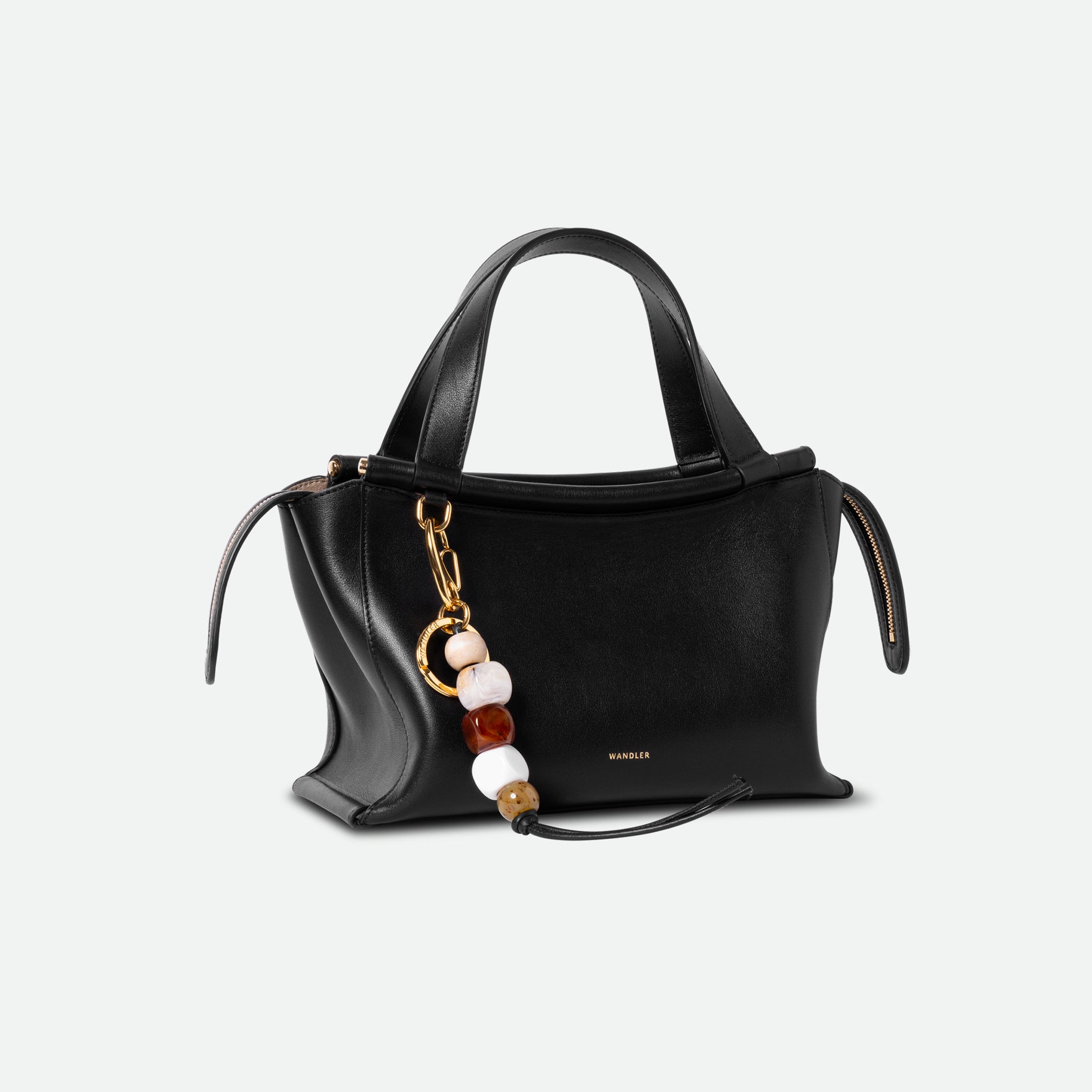 Wandler Bag Charm Marble Mix in brass and lambskin leather with golden hardware, shown as a bag charm, pictured   fastened to Hortensia bag, three quarters view. 