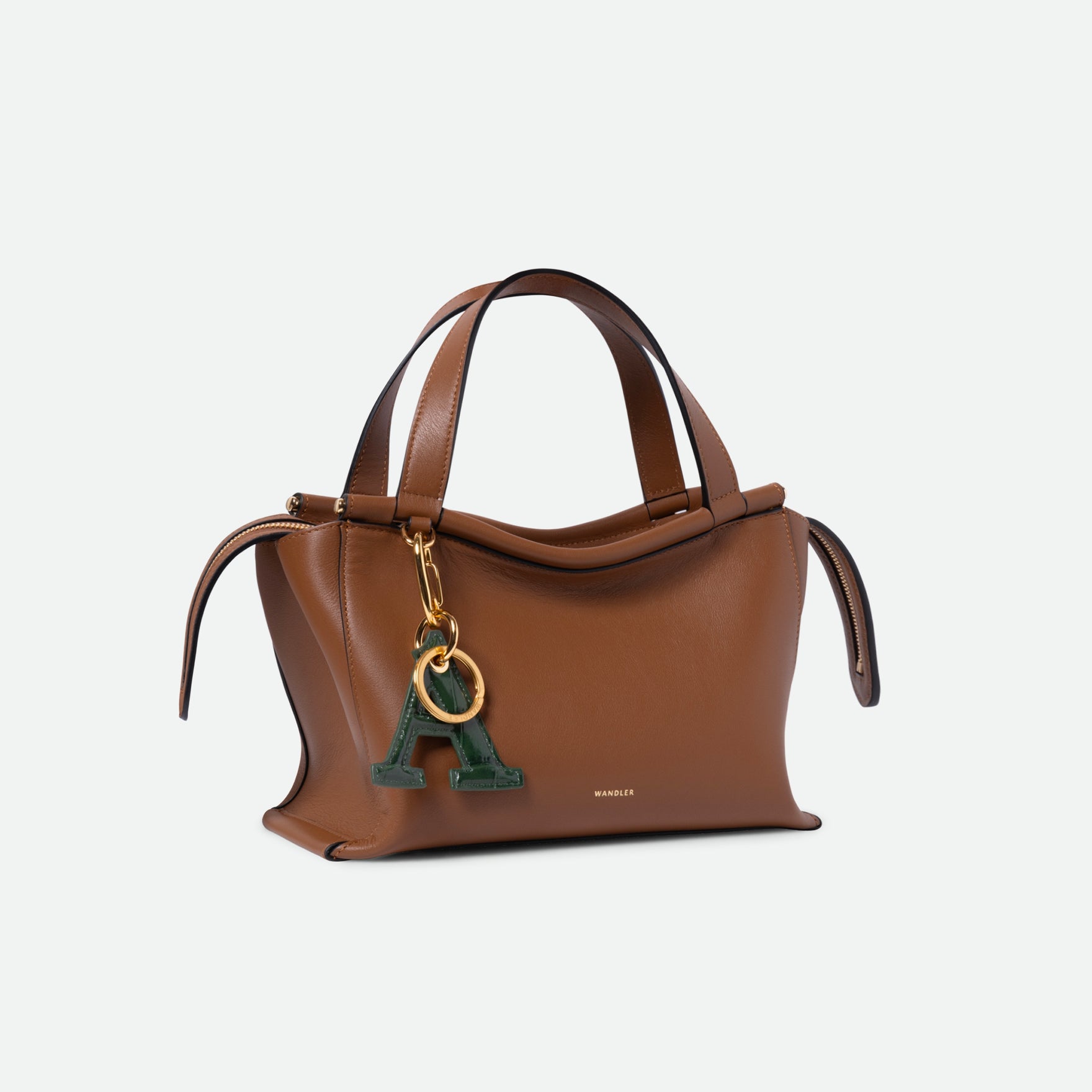 Wandler Bag Charm Letter in the color Olive Croco, green with crocodile print, Letter M, made from brass, lambskin leather with golden hardware, pictured being used as a bag charm on Ida Bag.