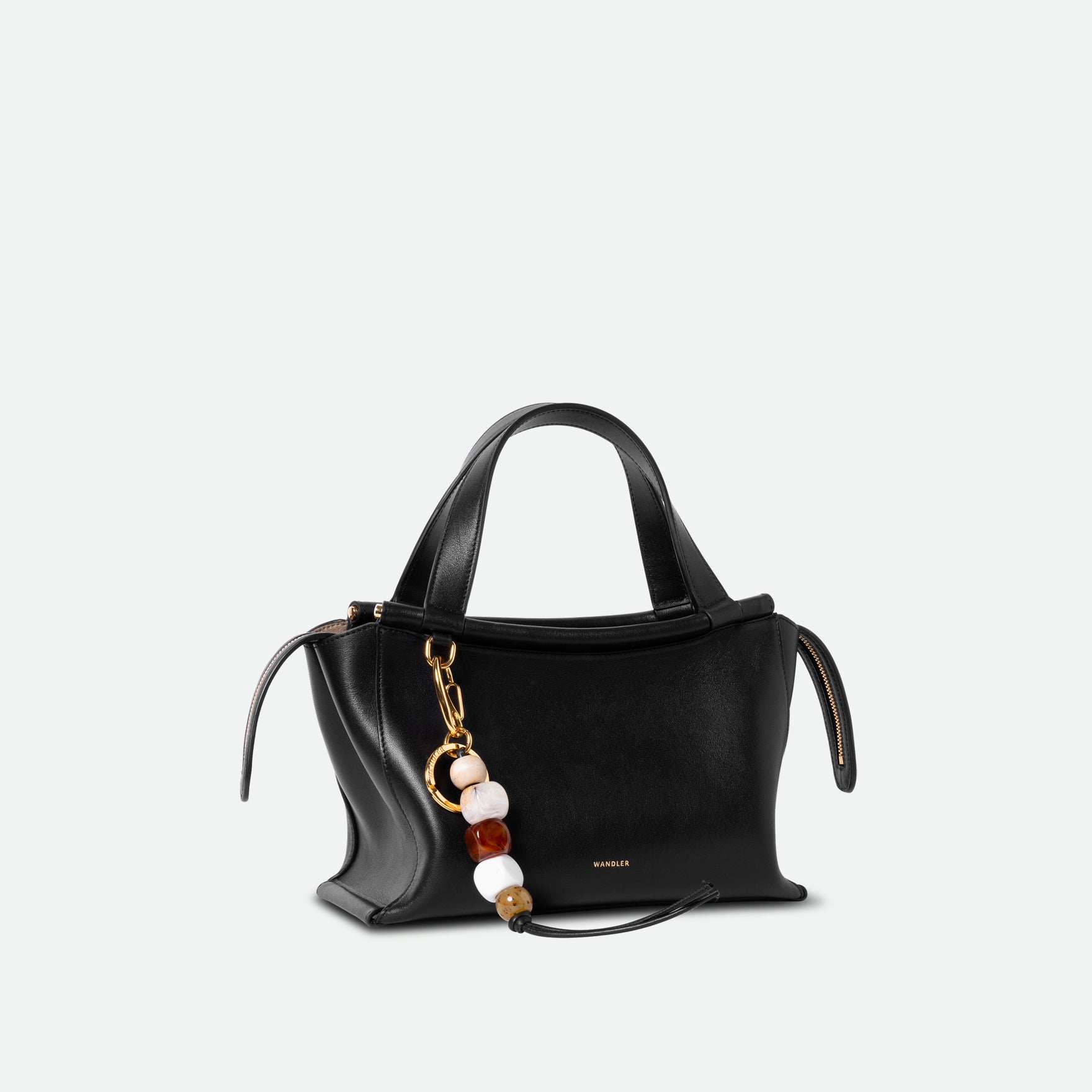 Wandler Bag Charm Marble Mix in brass and lambskin leather with golden hardware, shown as a bag charm, pictured   fastened to Ida bag. 