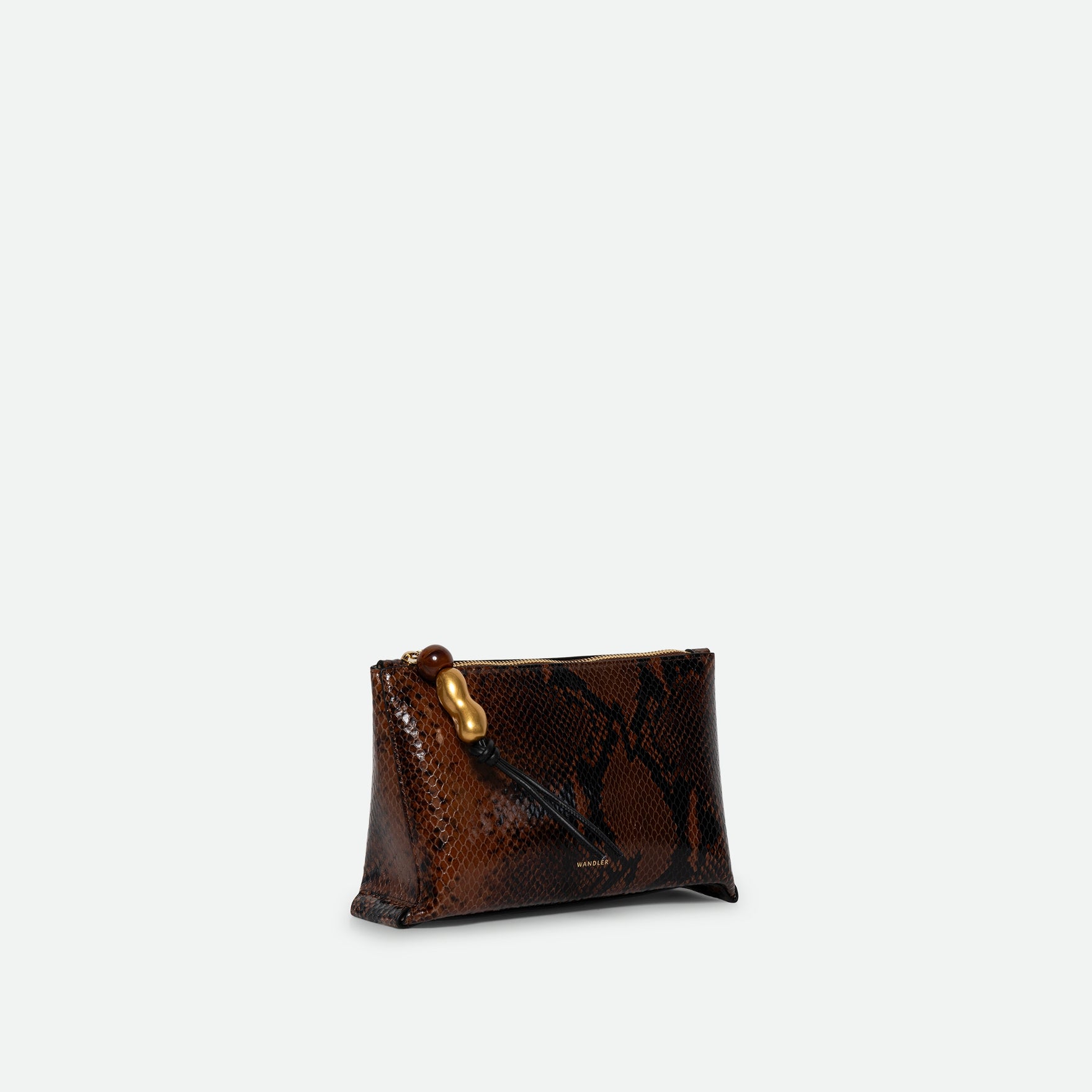 Wandler Ida Case in Brown Python soft calf leather with golden zipper hardware and charm, three quarters view. 