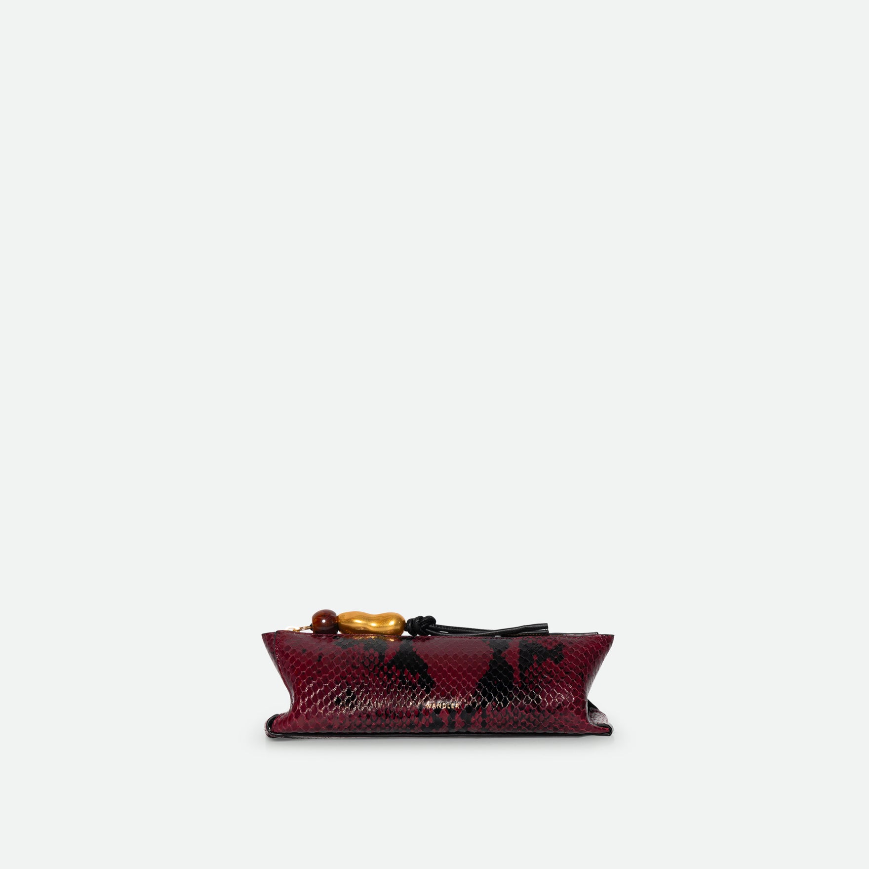 Wandler Ida Case Small in Bordeaux Python calf leather with golden zipper hardware and charm, front view.