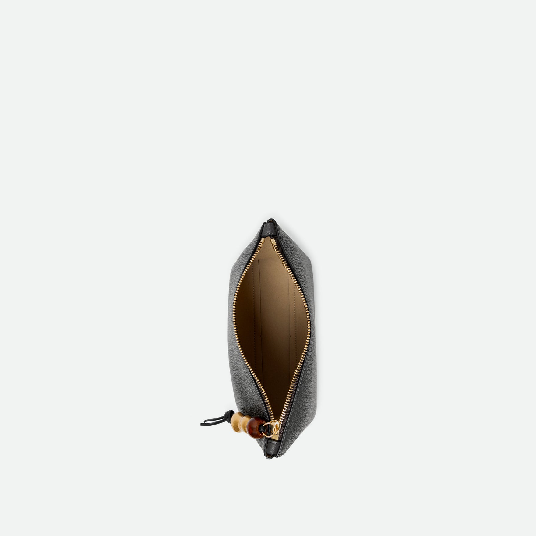 Wandler Ida Case in Space Crust, grey,  calf leather with golden zipper hardware and charm, pictured from above with the zipper open, giving a view of the inside of the bag. 