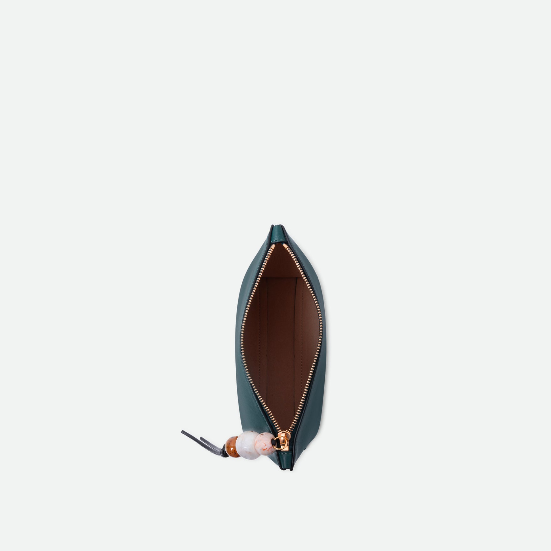 Wandler Ida Case in Teal made from calf leather with golden zipper hardware and charm, topside view with open zipper allowing for a glimpse of the inside of the case.