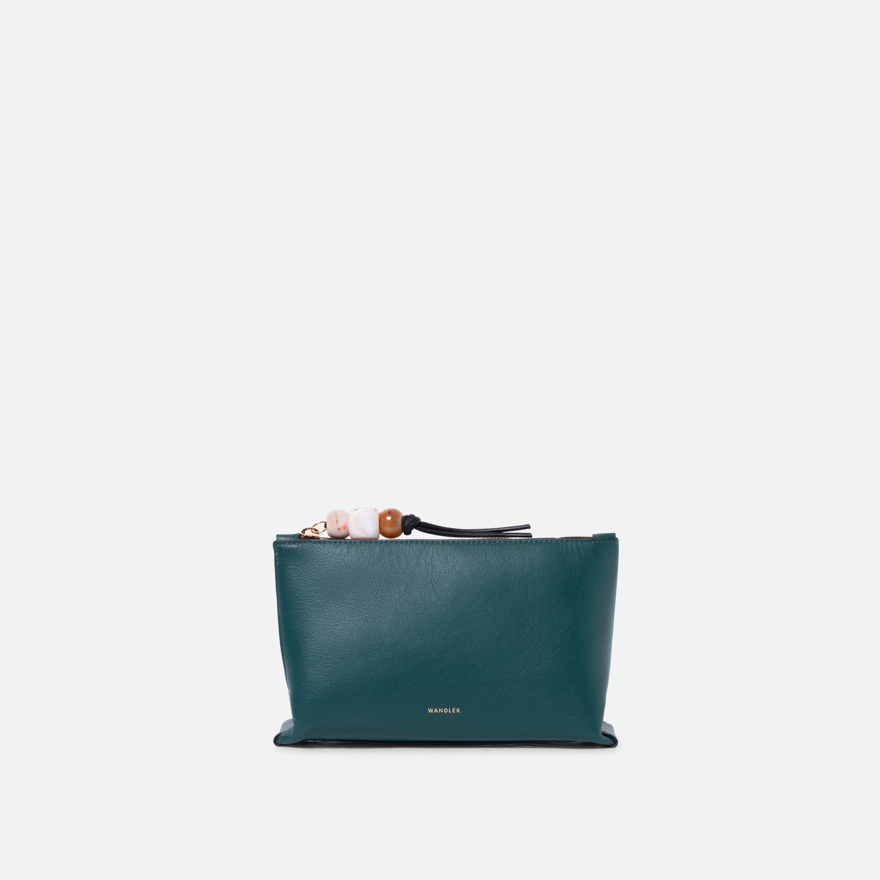 Wandler Ida Case in Teal made from calf leather with golden zipper hardware and charm, front view.