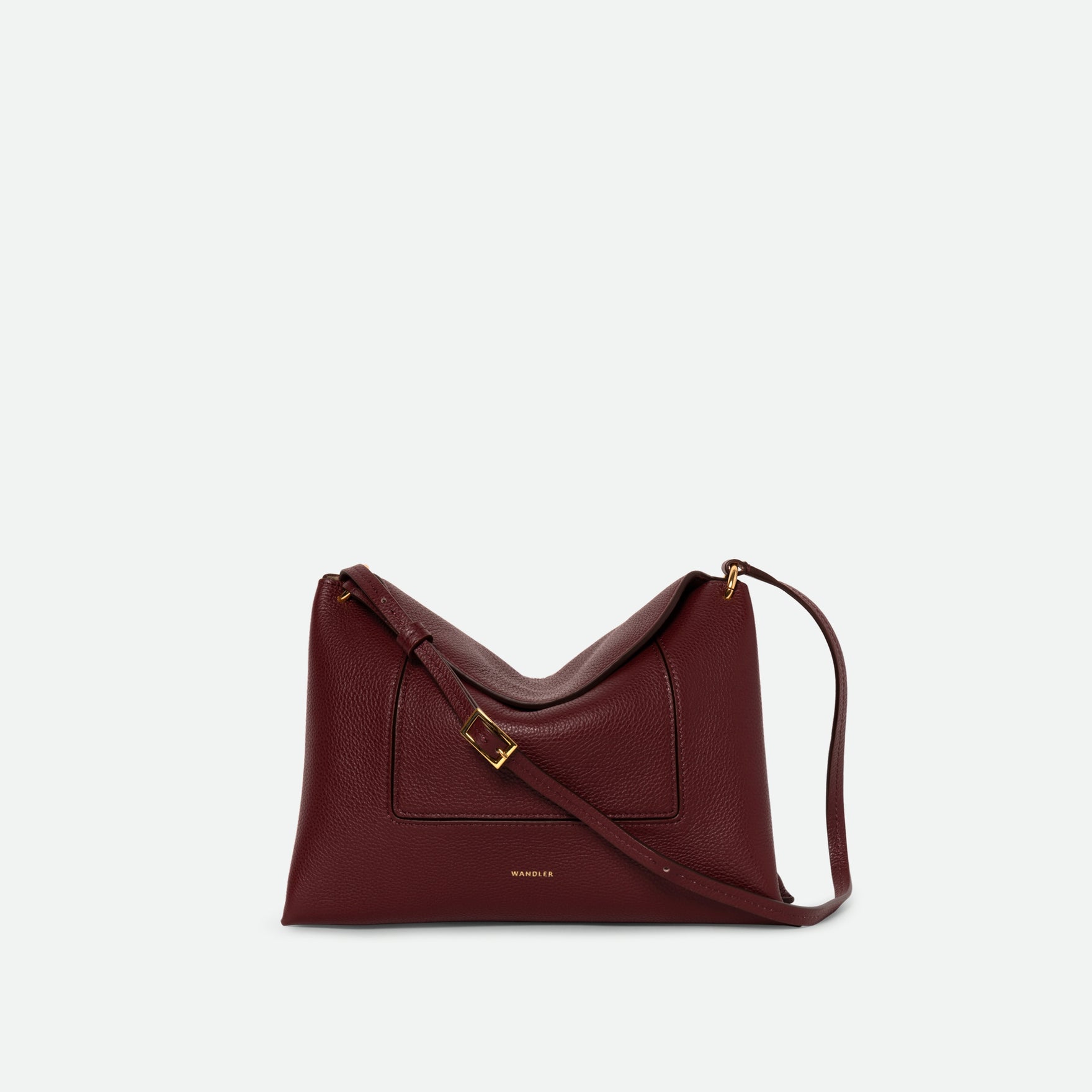 Wandler Penelope Slouch Bag in the color Acai Crust, deep dark red, made from smooth calf leather with golden hardware and adjustable slim strap, front view.