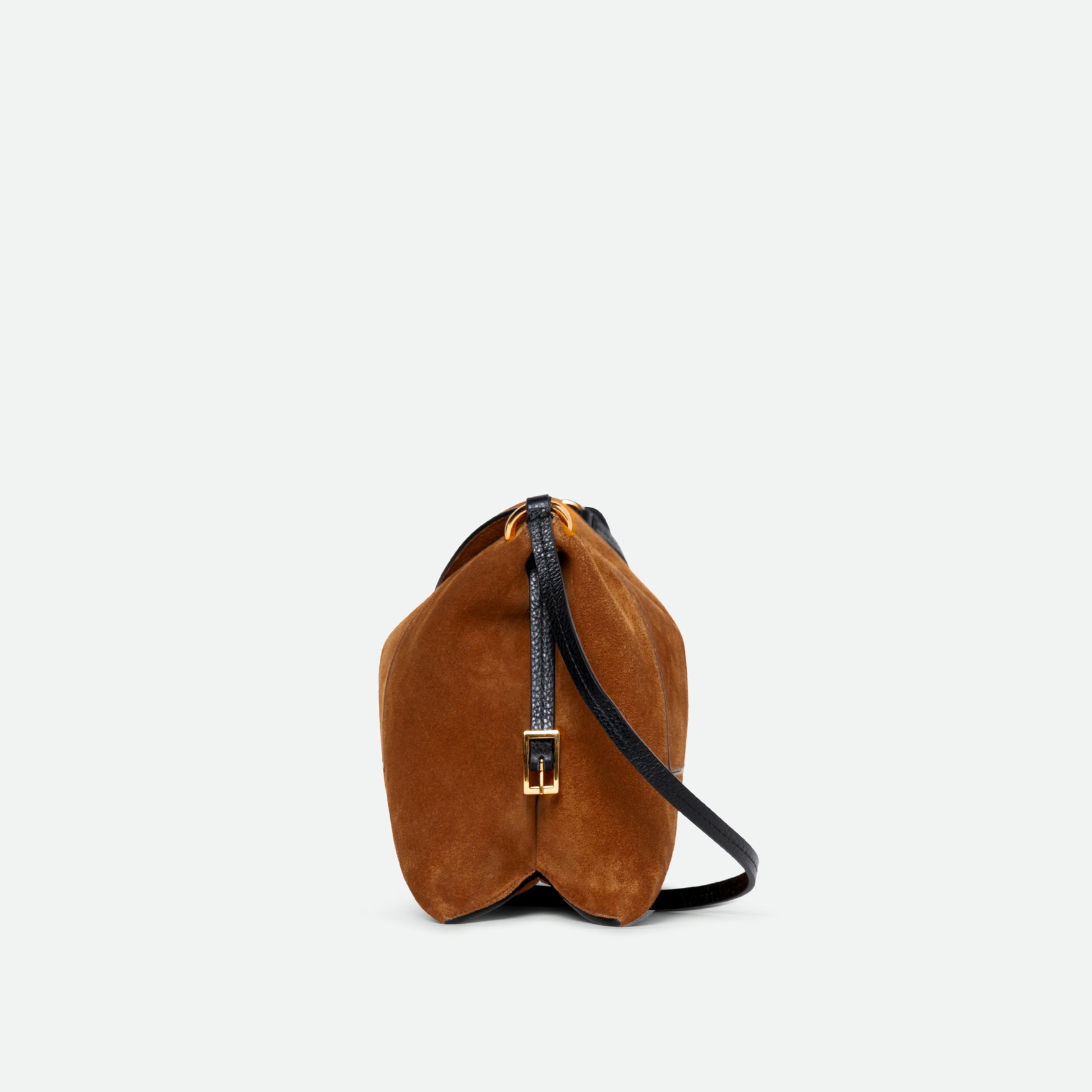 Wandler Penelope Slouch Bag in the color Cognac Suede, made from calf leather with golden hardware and adjustable slim strap, side view of the bag.
