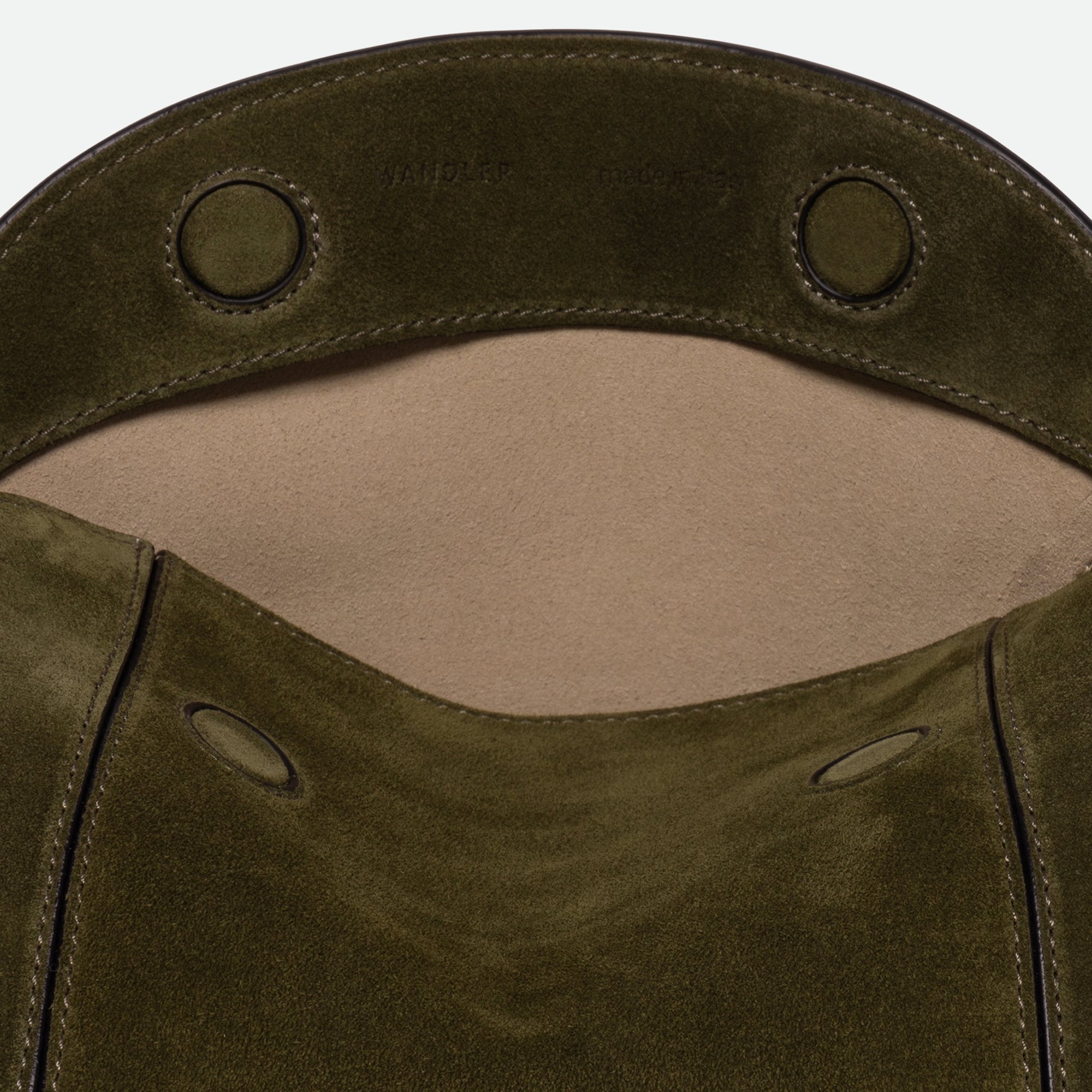 Wandler Penelope Slouch Bag in the color Orion Crust deep dark blue, made from calf leather with golden hardware and adjustable slim strap, close up detailing the logo and leather.